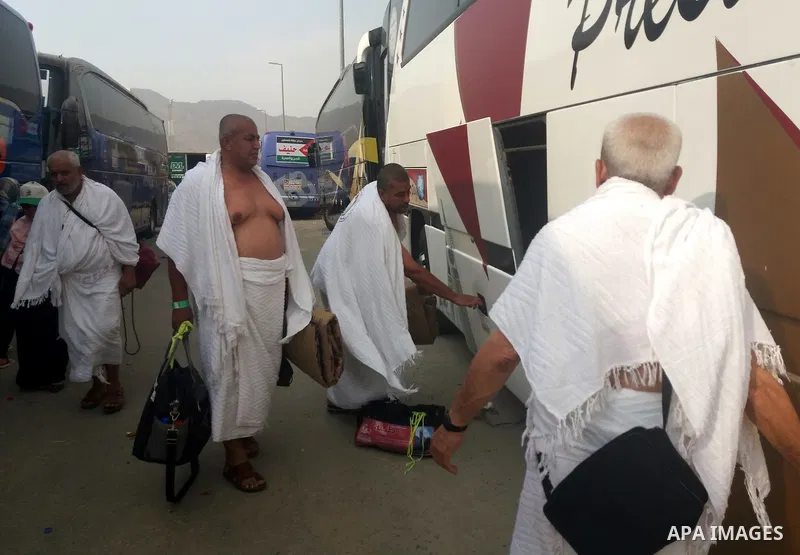 Muslim pilgrims walk near Mount Arafat, also known as Jabal al-Rahma (Mount of Mercy), southeast of the Saudi holy city of Mecca, on Arafat Day which is the climax of the Hajj pilgrimage early on August 31, 2017. Arafat...
