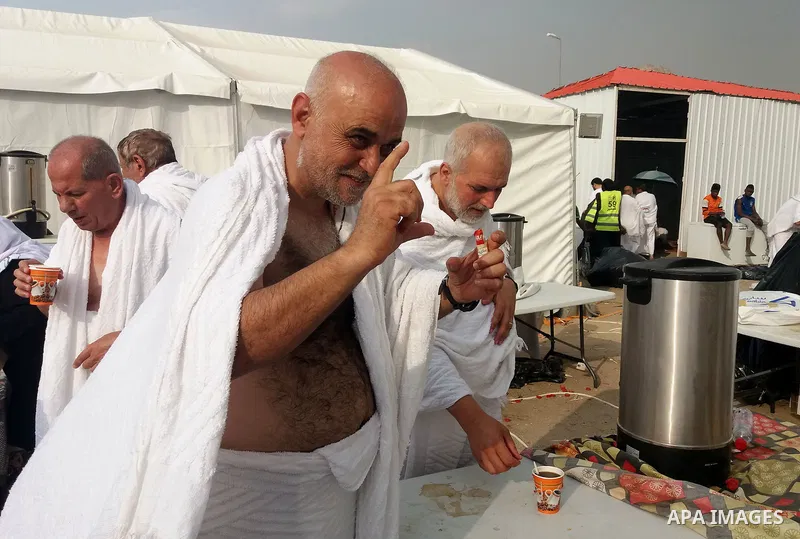 Muslim pilgrims rest near Mount Arafat, also known as Jabal al-Rahma (Mount of Mercy), southeast of the Saudi holy city of Mecca, on Arafat Day which is the climax of the Hajj pilgrimage early on August 31, 2017. Arafat...