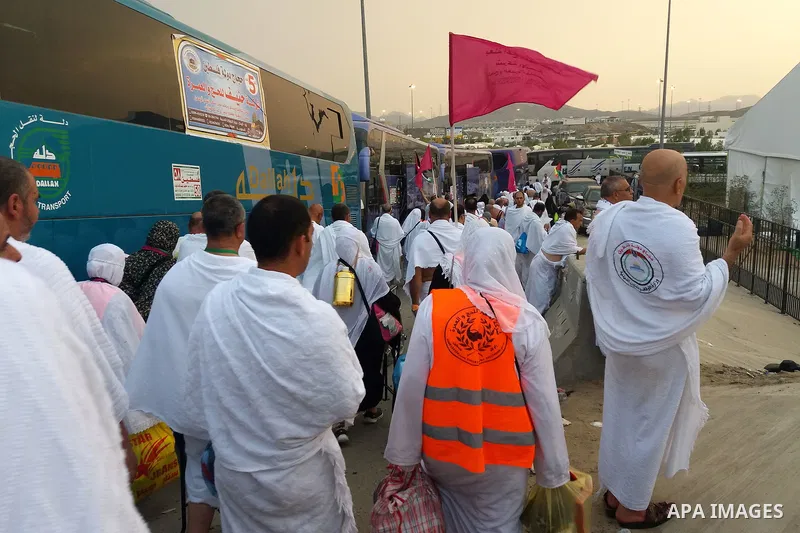 Muslim pilgrims walk near Mount Arafat, also known as Jabal al-Rahma (Mount of Mercy), southeast of the Saudi holy city of Mecca, on Arafat Day which is the climax of the Hajj pilgrimage early on August 31, 2017. Arafat...