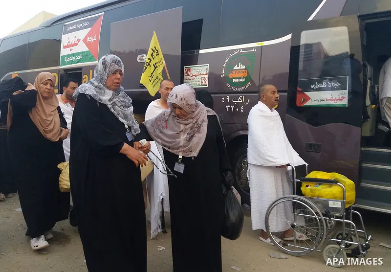 Muslim pilgrims walk near Mount Arafat, also known as Jabal al-Rahma (Mount of Mercy), southeast of the Saudi holy city of Mecca, on Arafat Day which is the climax of the Hajj pilgrimage early on August 31, 2017. Arafat...