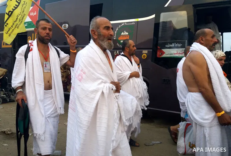 Muslim pilgrims walk near Mount Arafat, also known as Jabal al-Rahma (Mount of Mercy), southeast of the Saudi holy city of Mecca, on Arafat Day which is the climax of the Hajj pilgrimage early on August 31, 2017. Arafat...