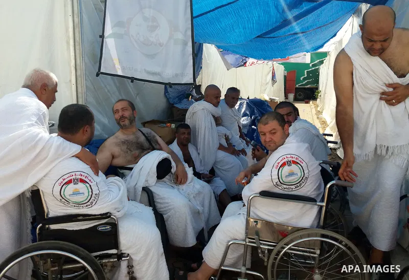 Muslim pilgrims rest near Mount Arafat, also known as Jabal al-Rahma (Mount of Mercy), southeast of the Saudi holy city of Mecca, on Arafat Day which is the climax of the Hajj pilgrimage early on August 31, 2017. Arafat...