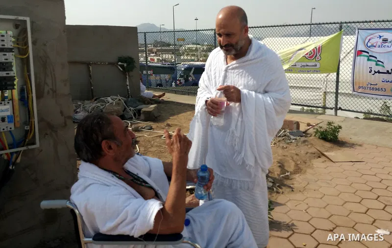 Muslim pilgrims rest near Mount Arafat, also known as Jabal al-Rahma (Mount of Mercy), southeast of the Saudi holy city of Mecca, on Arafat Day which is the climax of the Hajj pilgrimage early on August 31, 2017. Arafat...