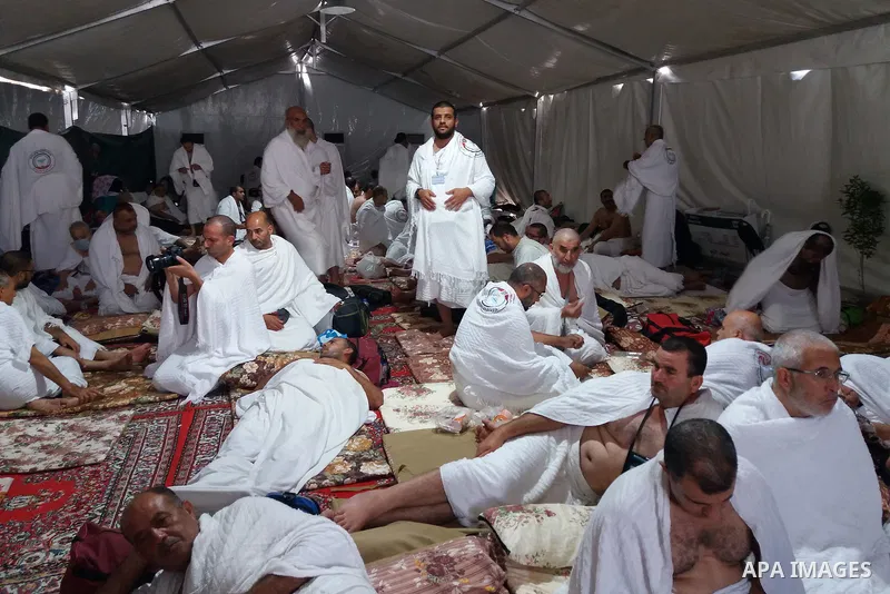 Muslim pilgrims rest near Mount Arafat, also known as Jabal al-Rahma (Mount of Mercy), southeast of the Saudi holy city of Mecca, on Arafat Day which is the climax of the Hajj pilgrimage early on August 31, 2017. Arafat...