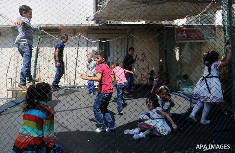 Palestinian children celebrate on of Eid al-Adha or the feast of sacrifice, in Gaza city, on September 1, 2017. Muslims around the world are celebrating Eid al-Adha, the "Feast of Sacrifice", which marks the end of the a...