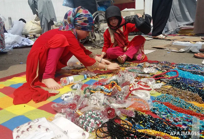 Muslim pilgrims shop on the secund day of Eid al-Adha at a market near the holy city of Mecca, on September 2, 2017. Muslims around the world are celebrating Eid al-Adha, the "Feast of Sacrifice", which marks the end of...