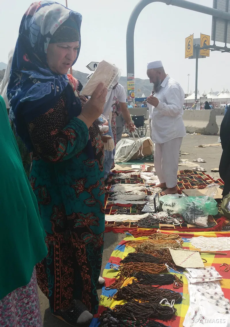 Muslim pilgrims shop on the secund day of Eid al-Adha at a market near the holy city of Mecca, on September 2, 2017. Muslims around the world are celebrating Eid al-Adha, the "Feast of Sacrifice", which marks the end of...