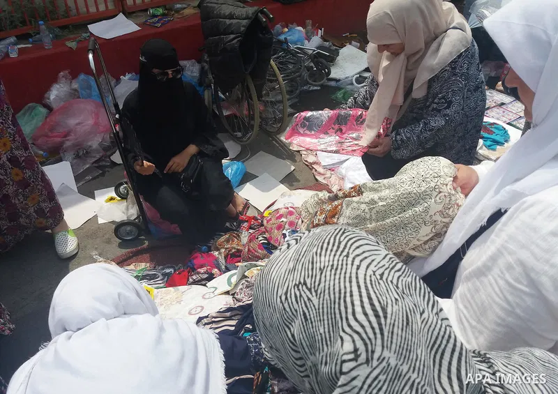 Muslim pilgrims shop on the secund day of Eid al-Adha at a market near the holy city of Mecca, on September 2, 2017. Muslims around the world are celebrating Eid al-Adha, the "Feast of Sacrifice", which marks the end of...