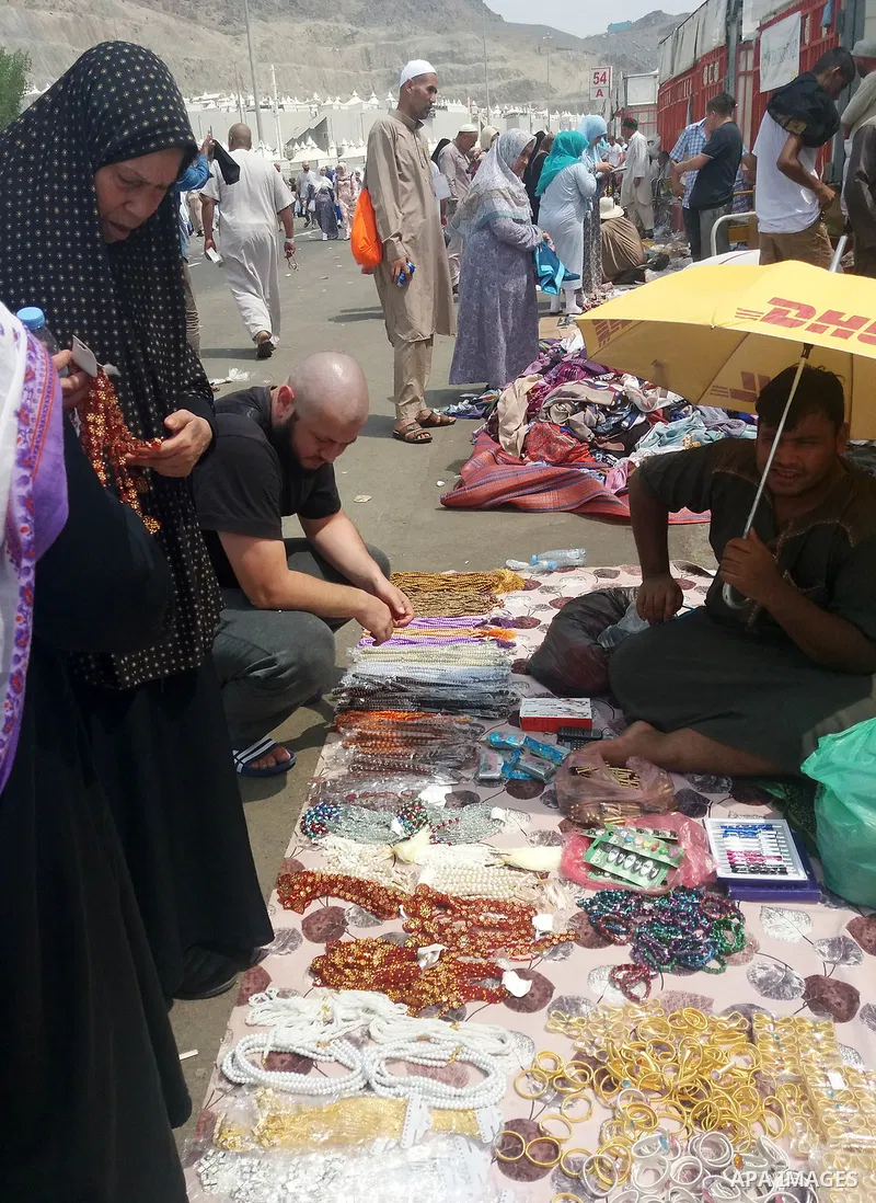 Muslim pilgrims shop on the secund day of Eid al-Adha at a market near the holy city of Mecca, on September 2, 2017. Muslims around the world are celebrating Eid al-Adha, the "Feast of Sacrifice", which marks the end of...