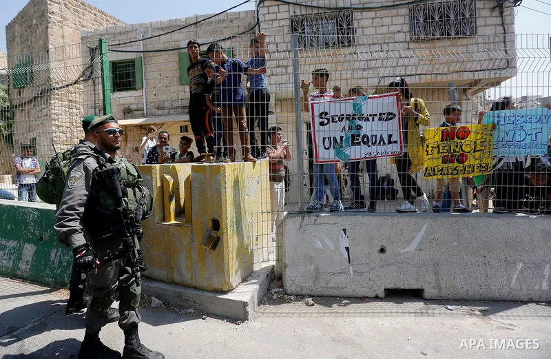 Israeli border policemen stand guard during a demonstration organised by young Palestinians in Hebron on September 3, 2017, against a recent decision by Israel to boost the powers of the settlers in the occupied West Ban...