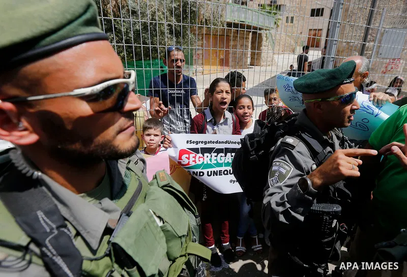 Israeli border policemen stand guard during a demonstration organised by young Palestinians in Hebron on September 3, 2017, against a recent decision by Israel to boost the powers of the settlers in the occupied West Ban...