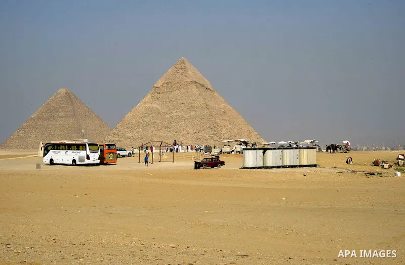 Egyptians celebrate on the third day of Eid al-Adha or the feast of sacrifice, in front of the Giza pyramids, in Cairo on September 03, 2017. Muslims around the world are celebrating Eid al-Adha, the "Feast of Sacrifice"...