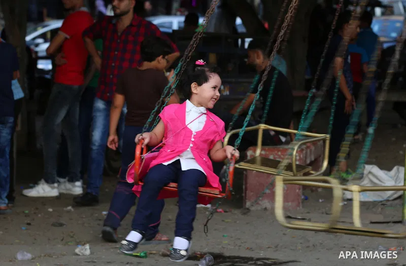 Palestinians celebrate on of Eid al-Adha or the feast of sacrifice, in Gaza city, on September 4, 2017. Muslims around the world are celebrating Eid al-Adha, the "Feast of Sacrifice", which marks the end of the annual pi...