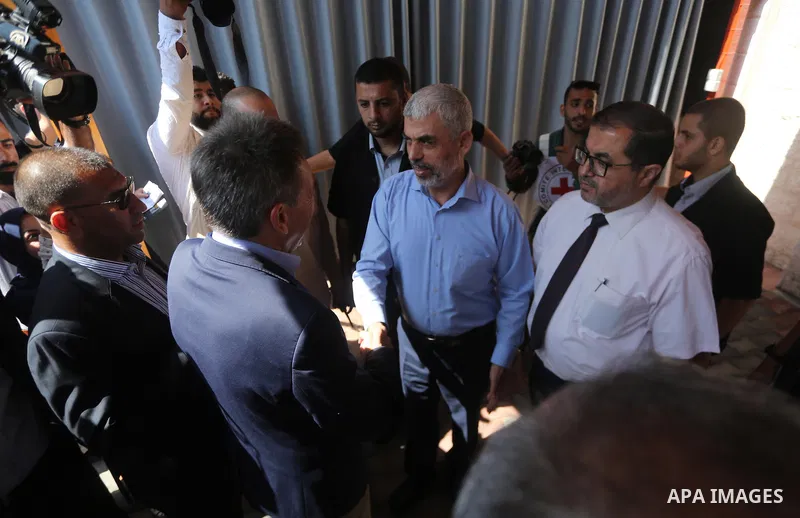 The head of the International Committee of the Red Cross, Peter Maurer (L), shakes hands with leader of the Hamas Islamist movement in Gaza Yahya Sinwar following a meeting in Gaza City, on September 5, 2017. Photo by Mo...
