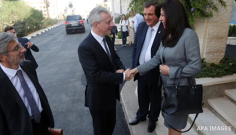 French Economy Minister Bruno Le Maire and ministers from the Palestinian government attend the opening of part of the new factory of Dar Al-Shifa, in the West Bank city of Ramallah, on Sept. 5, 2017. Photo by Shadi Hate...