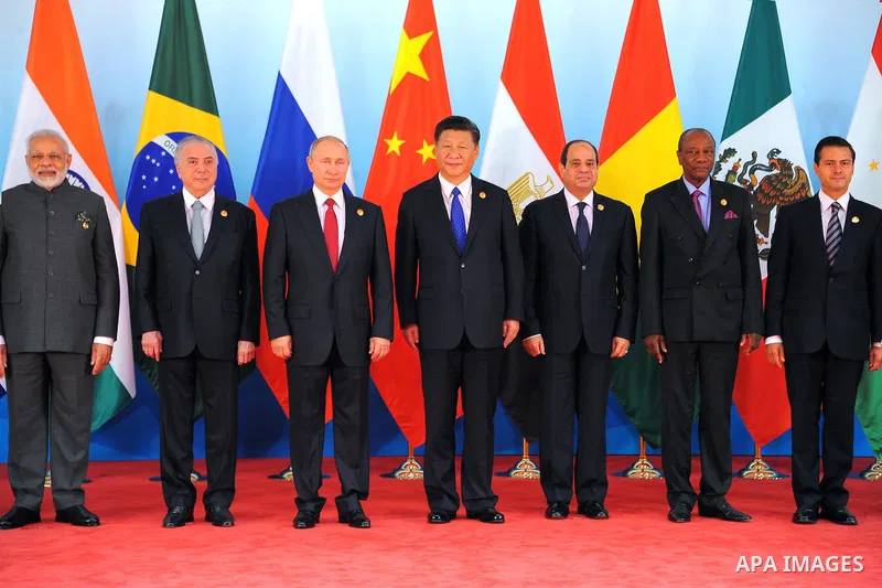 Chinese President Xi Jinping (5th L), Brazilian President Michel Temer (3rd L), Russian President Vladimir Putin (4th L), Indian Prime Minister Narendra Modi (2nd L), South African President Jacob Zuma (1st L), Egyptian...