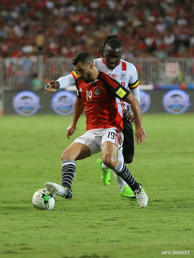 Egypt players compete with Uganda players in the FIFA World Cup 2018 qualification at the Borg al-Arab Stadium near Alexandria on September 5, 2017. Photo by Stringer