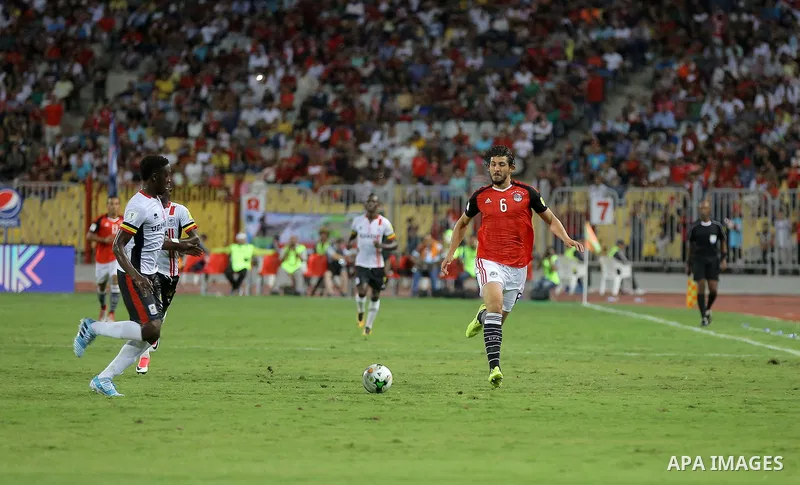 Egypt players compete with Uganda players in the FIFA World Cup 2018 qualification at the Borg al-Arab Stadium near Alexandria on September 5, 2017. Photo by Stringer