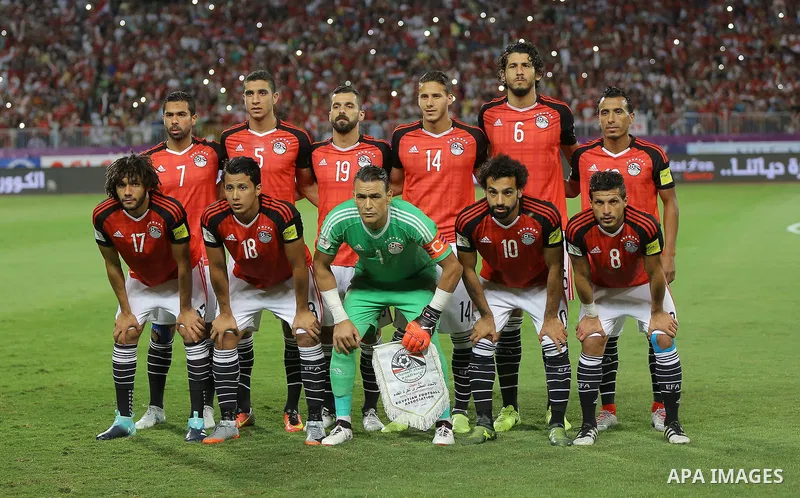 Egypt players compete with Uganda players in the FIFA World Cup 2018 qualification at the Borg al-Arab Stadium near Alexandria on September 5, 2017. Photo by Stringer