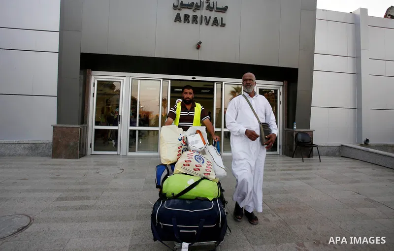 Palestinian pilgrims arrive at the Rafah crossing between Gaza Strip and Egypt after performing the annual Hajj, in Rafah in southern Gaza Strip, September 8, 2017. Photo by Ramadan El-agha