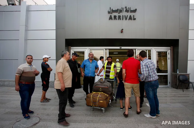 Palestinian pilgrims arrive at the Rafah crossing between Gaza Strip and Egypt after performing the annual Hajj, in Rafah in southern Gaza Strip, September 8, 2017. Photo by Ramadan El-agha