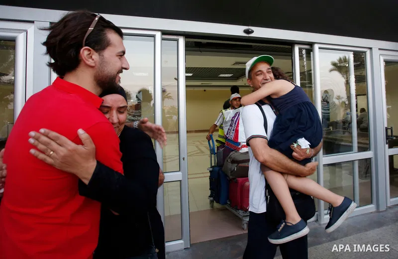 Palestinian pilgrims arrive at the Rafah crossing between Gaza Strip and Egypt after performing the annual Hajj, in Rafah in southern Gaza Strip, September 8, 2017. Photo by Ramadan El-agha