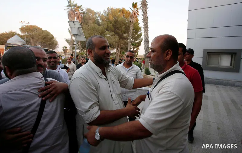 Palestinian pilgrims arrive at the Rafah crossing between Gaza Strip and Egypt after performing the annual Hajj, in Rafah in southern Gaza Strip, September 8, 2017. Photo by Ramadan El-agha