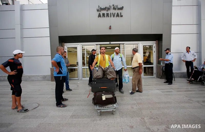 Palestinian pilgrims arrive at the Rafah crossing between Gaza Strip and Egypt after performing the annual Hajj, in Rafah in southern Gaza Strip, September 8, 2017. Photo by Ramadan El-agha