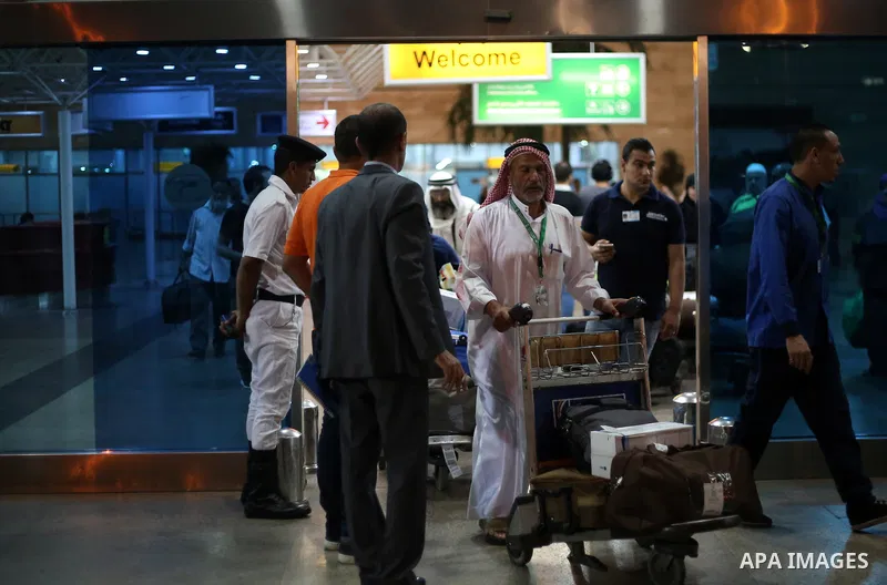 Palestinian pilgrims arrive to Cairo airport after performing the annual Hajj, in Cairo, Egypt, on September 9, 2017. Photo by Amr Sayed