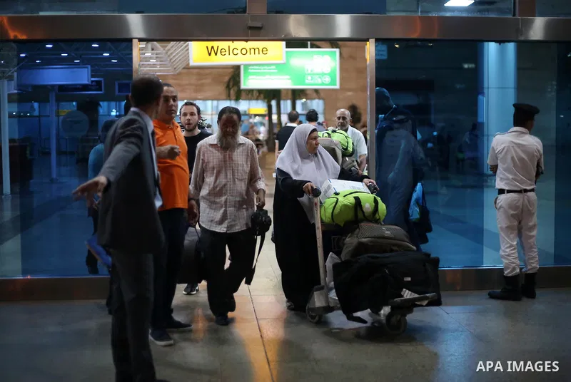 Palestinian pilgrims arrive to Cairo airport after performing the annual Hajj, in Cairo, Egypt, on September 9, 2017. Photo by Amr Sayed