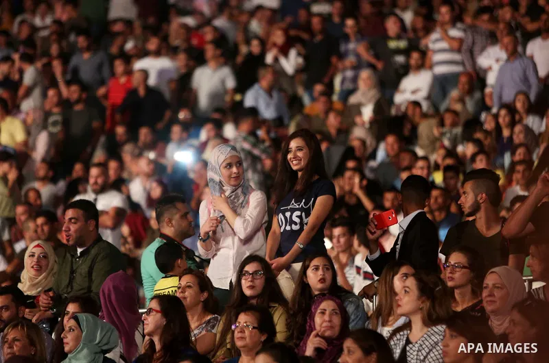 Palestinians attend a concert by Palestinian singer Mohammed Assaf Winner of Arab Idol 2013 in the West Bank city of Rawabi on Septemper 8, 2017. Photo by Shadi Hatem