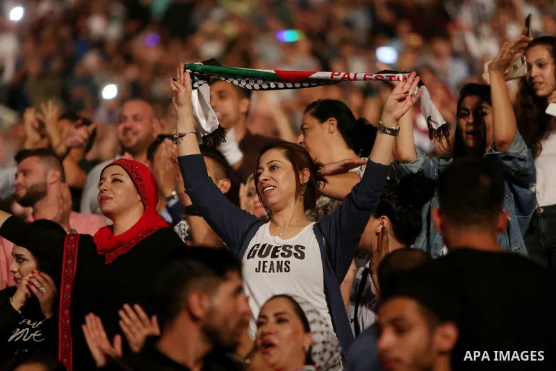 Palestinians attend a concert by Palestinian singer Mohammed Assaf Winner of Arab Idol 2013 in the West Bank city of Rawabi on Septemper 8, 2017. Photo by Shadi Hatem