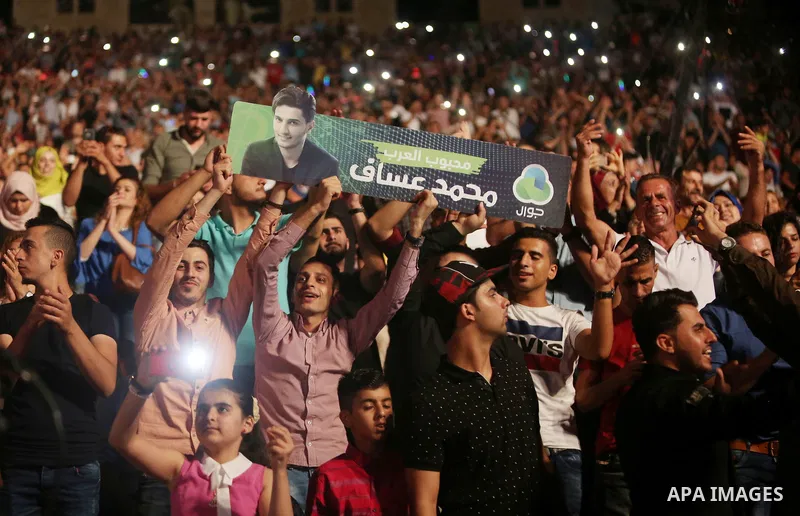 Palestinians attend a concert by Palestinian singer Mohammed Assaf Winner of Arab Idol 2013 in the West Bank city of Rawabi on Septemper 8, 2017. Photo by Shadi Hatem
