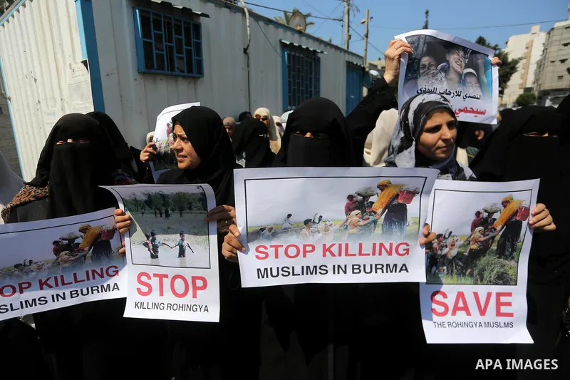 Palestinian women hold placards during a protest gainst killing of Muslims in Burma in front of the high commissioner for human rights headquarters, in Gaza city on Sept. 10, 2017. Photo by Mohammed Asad