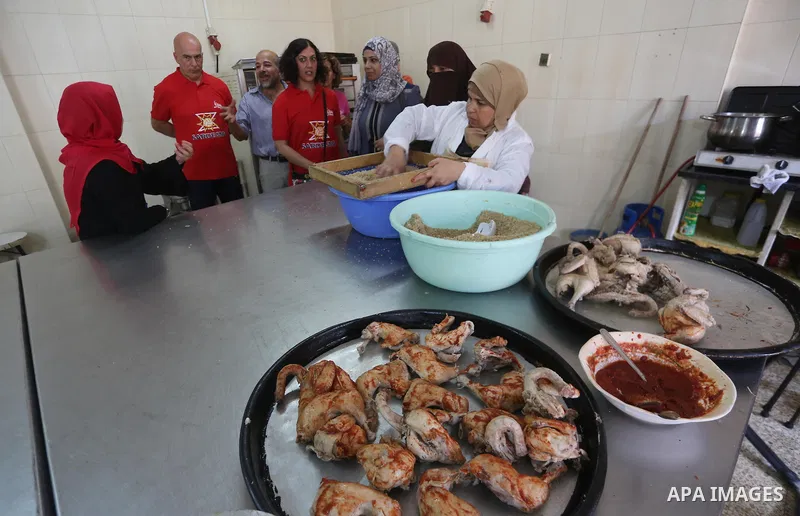 Italian and Palestinian chefs prepare traditional dishes from both of their countries during a workshop in Nuseirat in the center of Gaza strip, on September 11, 2017. Photo by Mohammed Asad