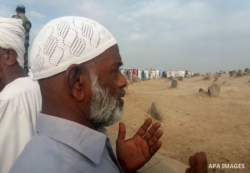Muslim pilgrims visit Al-Baqi, the main cemetery for people are buried since the era of the Prophet Mohammad's family, relatives and companions, behind the Al-Masjid al-Nabawi, (the Mosque of the Prophet), after their du...