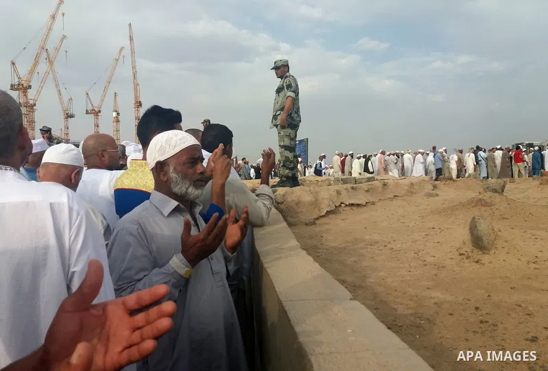 Muslim pilgrims visit Al-Baqi, the main cemetery for people are buried since the era of the Prophet Mohammad's family, relatives and companions, behind the Al-Masjid al-Nabawi, (the Mosque of the Prophet), after their du...