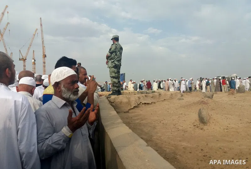 Muslim pilgrims visit Al-Baqi, the main cemetery for people are buried since the era of the Prophet Mohammad's family, relatives and companions, behind the Al-Masjid al-Nabawi, (the Mosque of the Prophet), after their du...