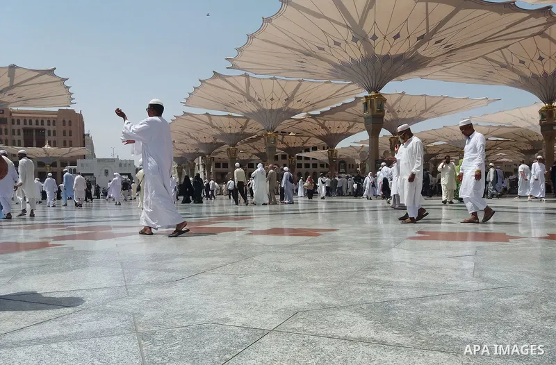 Muslims pilgrims visit the tomb of Prophet Mohammad at Al-Masjid al-Nabawi (The Mosque of the Prophet) after their duty of pilgrimage in the holy city of Medina, Saudi Arabia Sept. 11, 2017. Photo by Mohammed Hassan