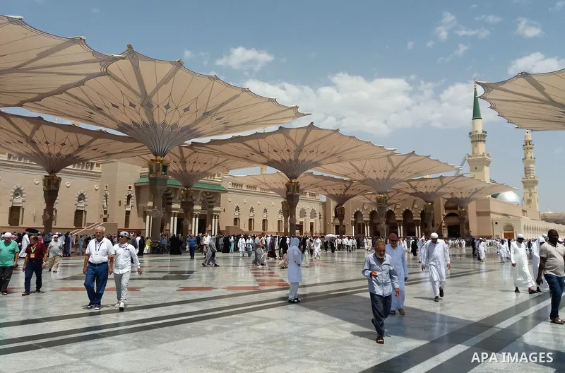 Muslims pilgrims visit the tomb of Prophet Mohammad at Al-Masjid al-Nabawi (The Mosque of the Prophet) after their duty of pilgrimage in the holy city of Medina, Saudi Arabia Sept. 11, 2017. Photo by Mohammed Hassan