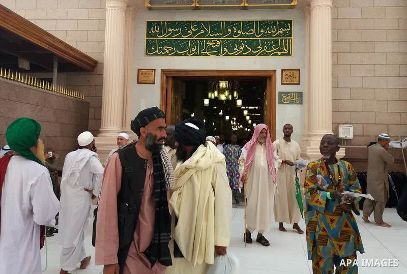 Muslims pilgrims visit the tomb of Prophet Mohammad at Al-Masjid al-Nabawi (The Mosque of the Prophet) after their duty of pilgrimage in the holy city of Medina, Saudi Arabia Sept. 11, 2017. Photo by Mohammed Hassan
