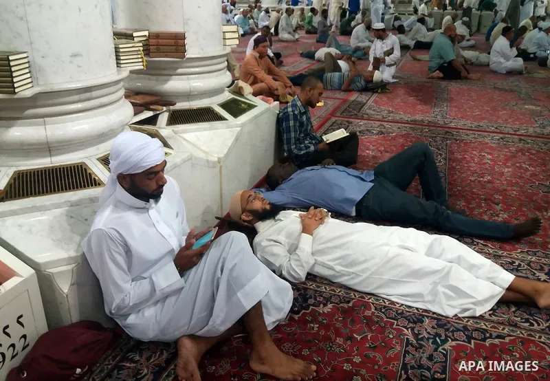 Muslims pilgrims visit the tomb of Prophet Mohammad at Al-Masjid al-Nabawi (The Mosque of the Prophet) after their duty of pilgrimage in the holy city of Medina, Saudi Arabia Sept. 11, 2017. Photo by Mohammed Hassan