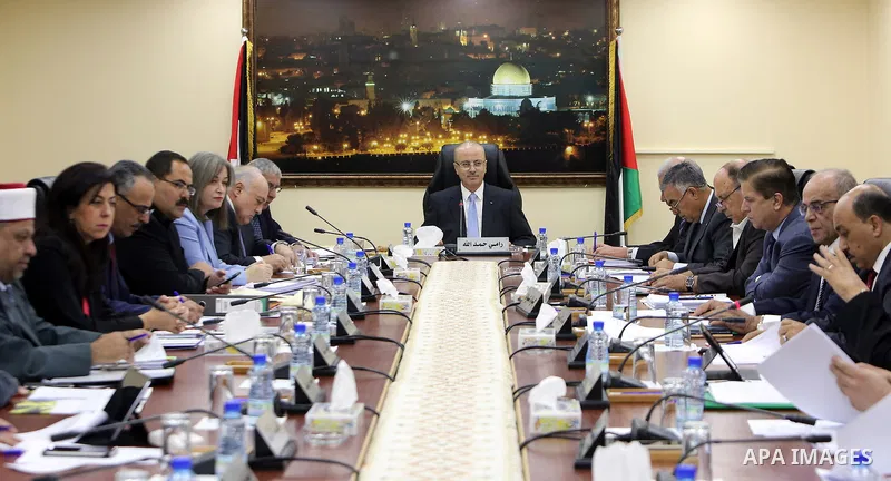 Palestinian Prime Minister, Rami hamdallah, chairs the Palestinian council meeting in the West Bank city of Ramallah on September 12, 2017. Photo by Prime Minister Office