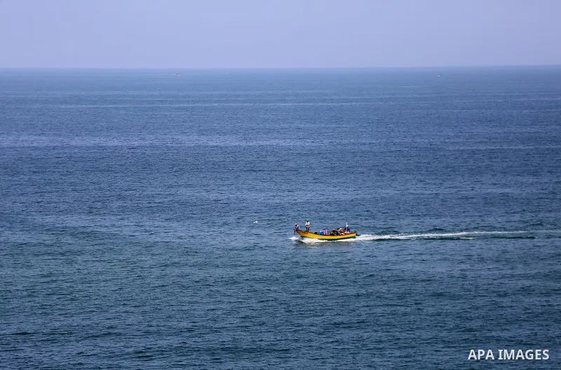Palestinians ride their boat in the Mediterranean sea on the coast of Gaza city, on September 13, 2017. Photo by Mohammed Asad