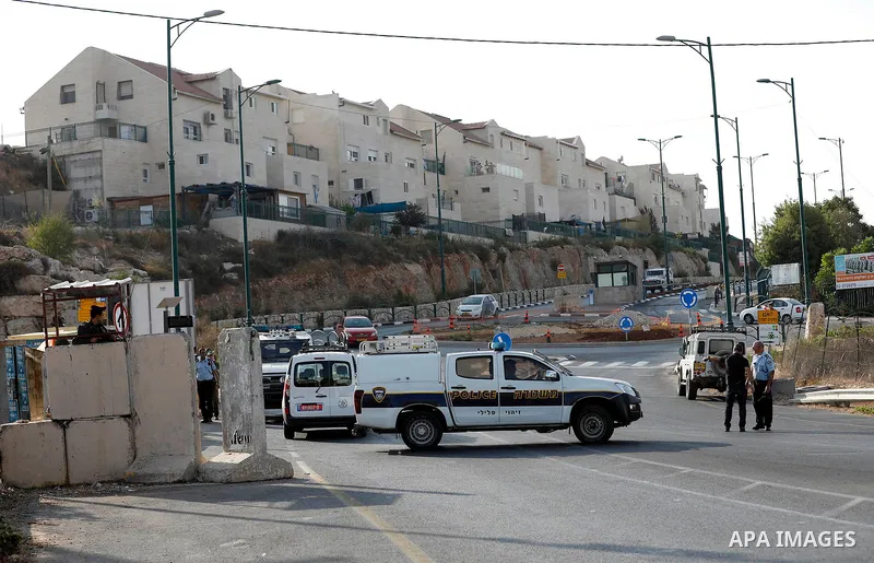 Israeli forensic policemen gather evidence at the site of a stabbing attack on the entrance of Jewish settlement of Kiryat Arba near the West Bank city of Hebron on Septemper 13, 2017. Israeli forces shot and wounded a 1...