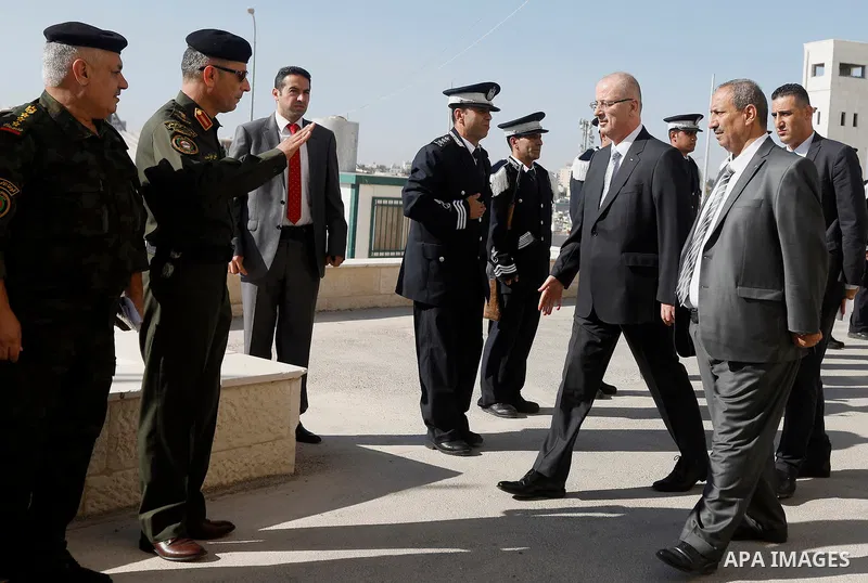Palestinian Prime Minister Rami Hamdallah arrives before a meeting with Palestinian security chiefs in the West Bank city of Hebron on September 18, 2017. Photo by Wisam Hashlamoun
