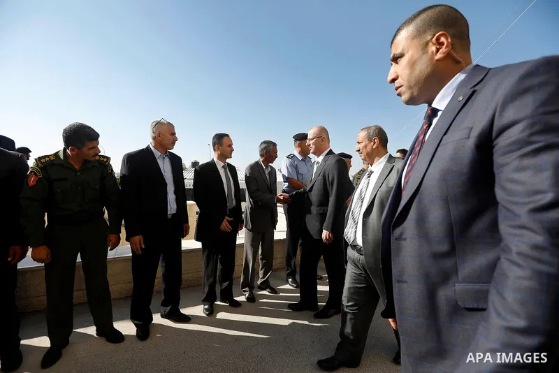 Palestinian Prime Minister Rami Hamdallah arrives before a meeting with Palestinian security chiefs in the West Bank city of Hebron on September 18, 2017. Photo by Wisam Hashlamoun