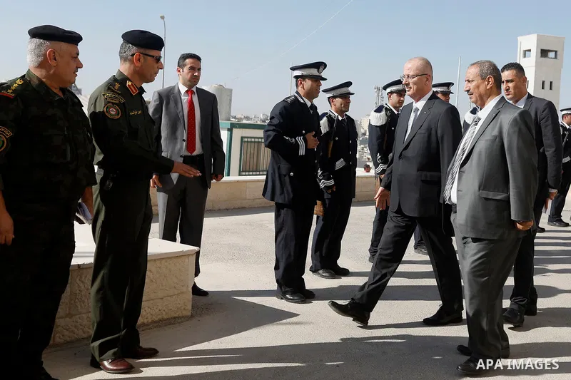 Palestinian Prime Minister Rami Hamdallah arrives before a meeting with Palestinian security chiefs in the West Bank city of Hebron on September 18, 2017. Photo by Wisam Hashlamoun