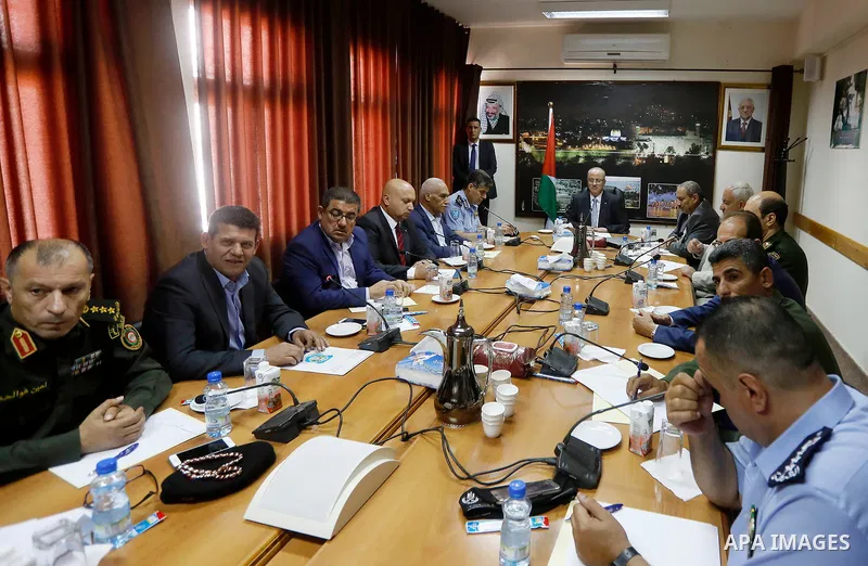 Palestinian Prime Minister Rami Hamdallah meets with Palestinian security chiefs in the West Bank city of Hebron on September 18, 2017. Photo by Wisam Hashlamoun