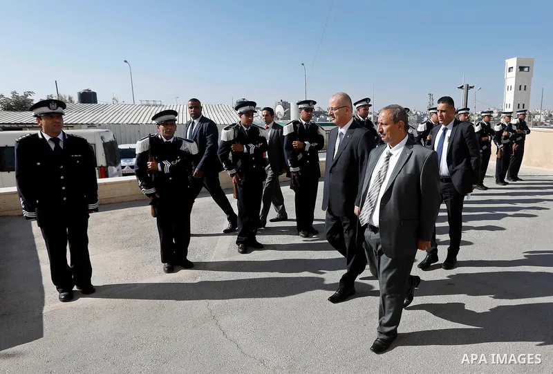 Palestinian Prime Minister Rami Hamdallah arrives before a meeting with Palestinian security chiefs in the West Bank city of Hebron on September 18, 2017. Photo by Wisam Hashlamoun